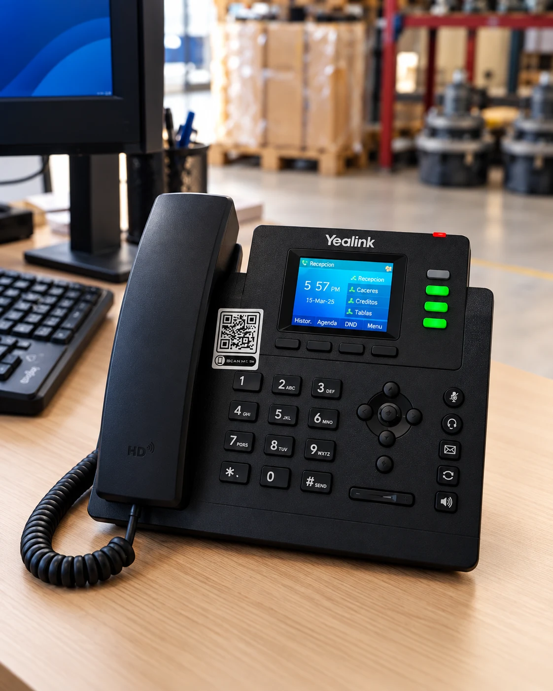 Terminal de telefonía IP Yealink en un puesto de trabajo.